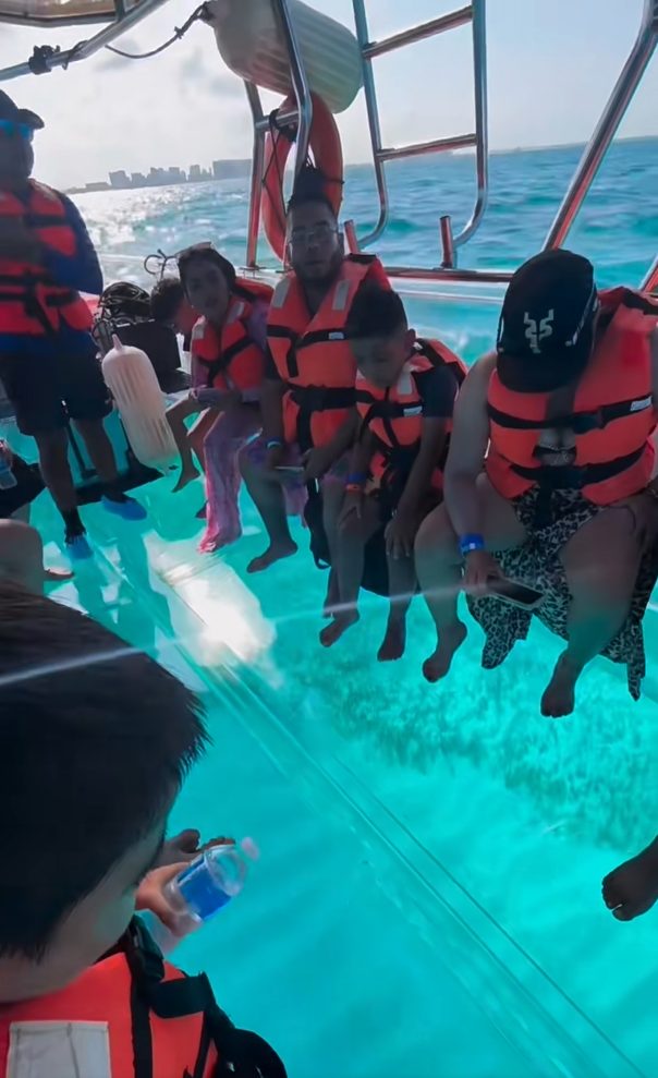 Passengers enjoying the transparent boat tour